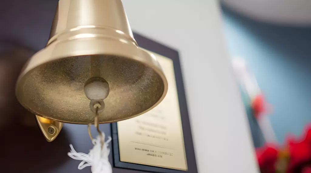 An example of a wall-mounted bell in a hospital that a patient may ring at important moments in the treatment journey. 