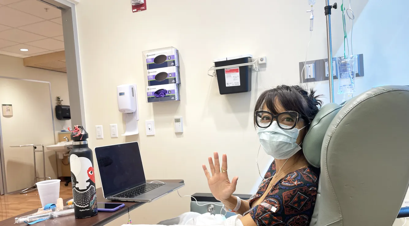 Woman waving chair chemo