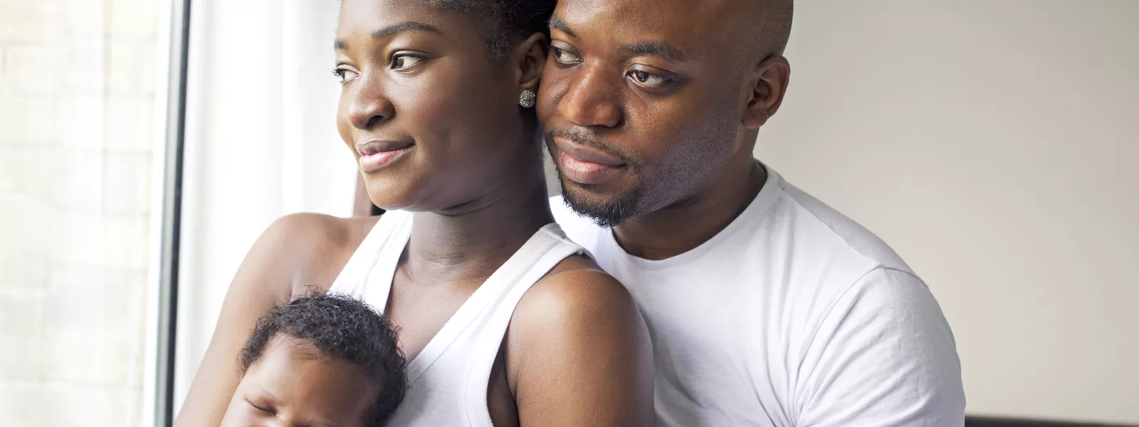 black couple with their infant