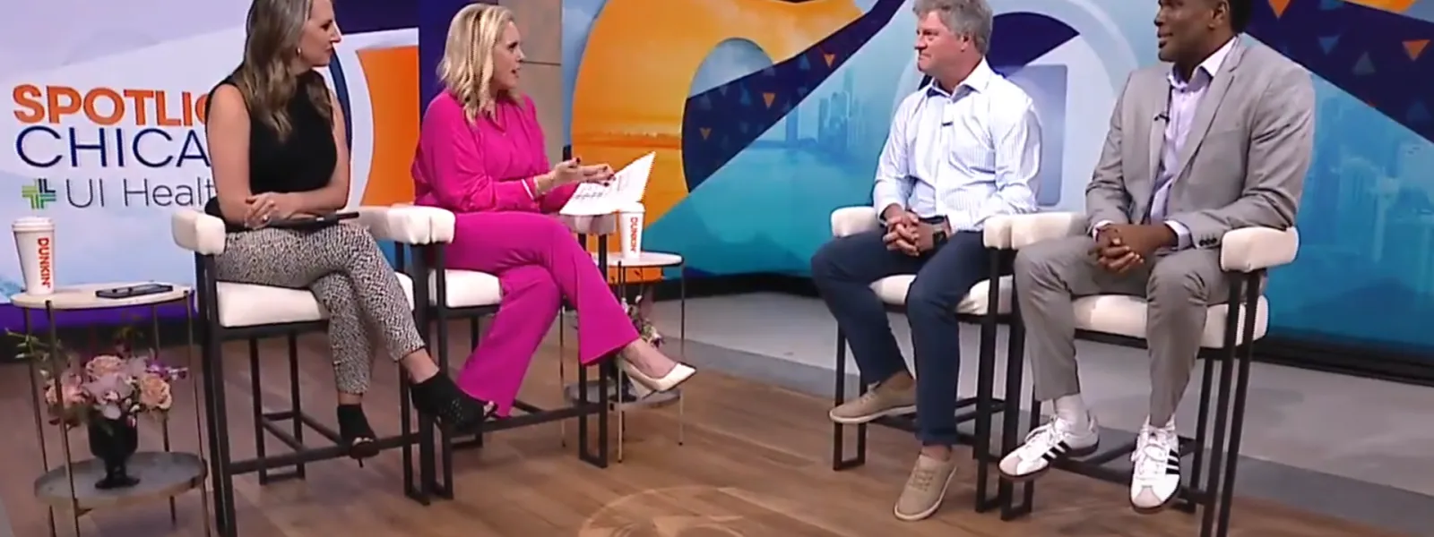 People in a television news station conducting an interview.