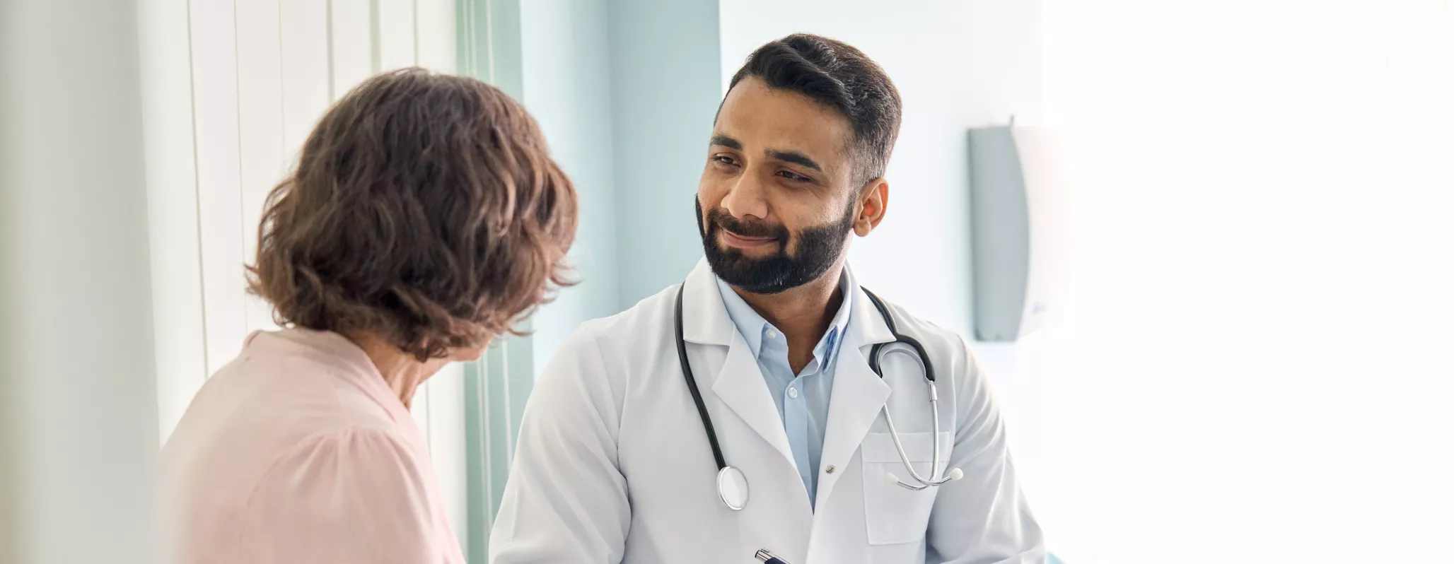 young man talking to doctor