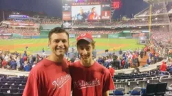 Dylan and his father at a baseball game. 
