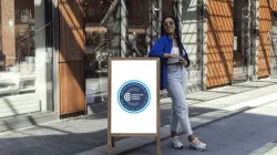 Colorectal Cancer Alliance emblem reading 'Proud Supporter of the Mission to End CRC,' displayed on a sandwich board sign.