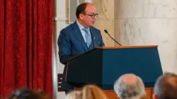 Michael Sapienza at the podium