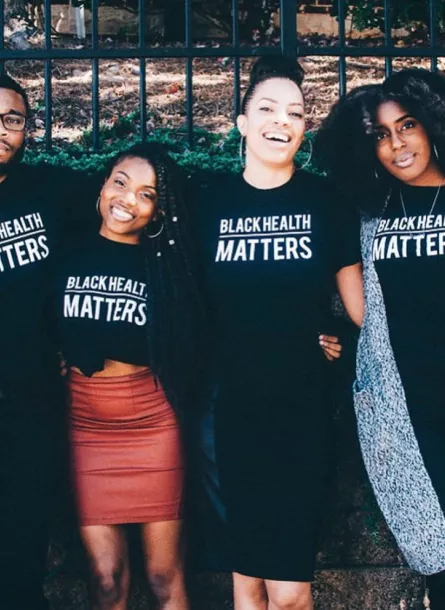 BLKHLTH Team members in shirts that say "Black Health Matters"
