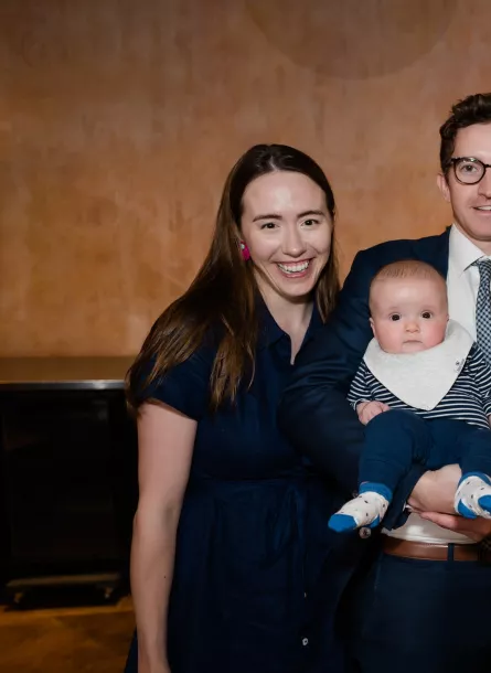 Family smiling with baby at Chicago Blue Hope Bash