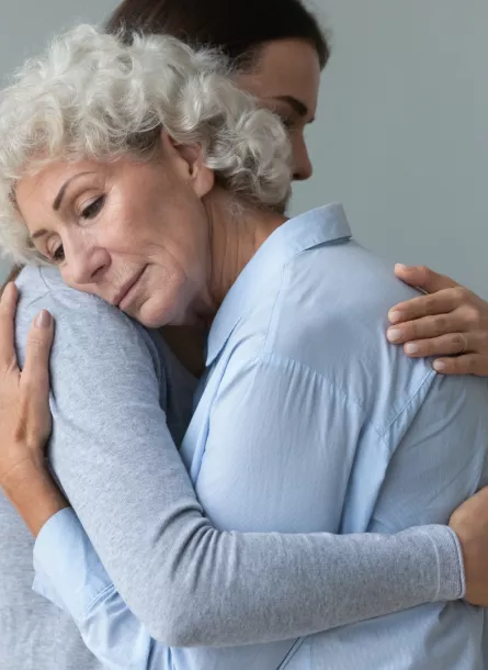 grief - two women hug