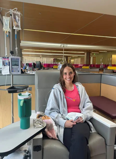 Smiling woman sitting in chair during treatment