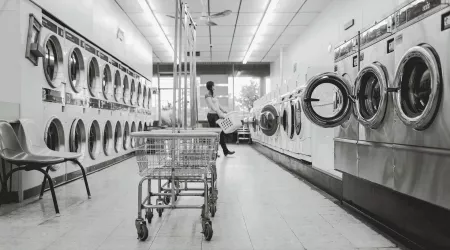 a woman does laundry 