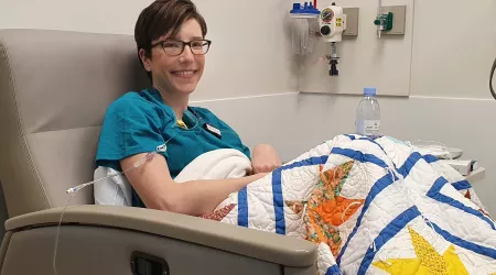 A photograph of Lexie in a chemotherapy chair. 