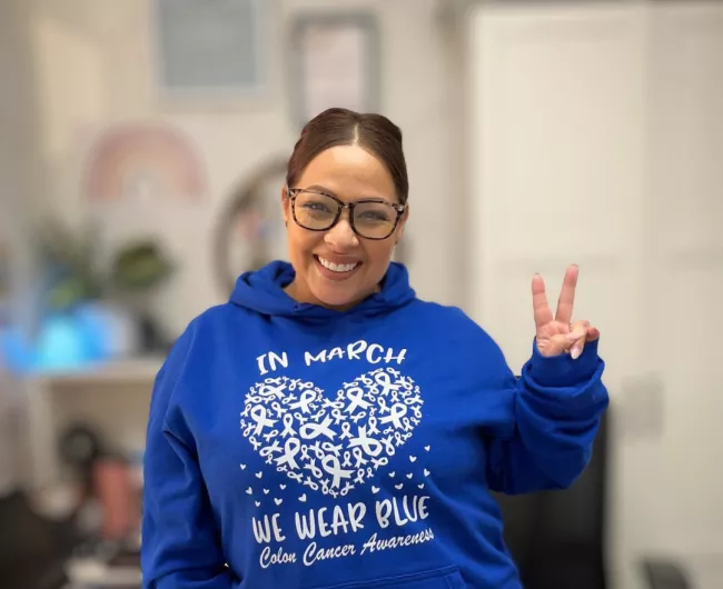 Woman in March we wear blue sweatshirt