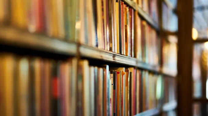 books on shelf blurry