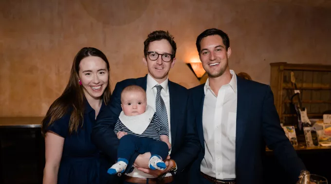 Family smiling with baby at Chicago Blue Hope Bash