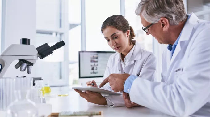 two people doing lab research