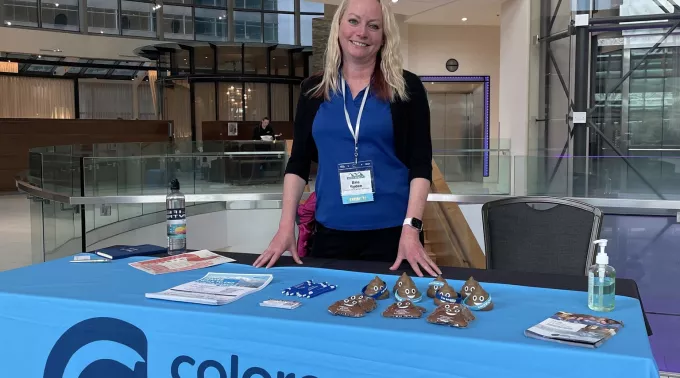 Woman at table advocate event