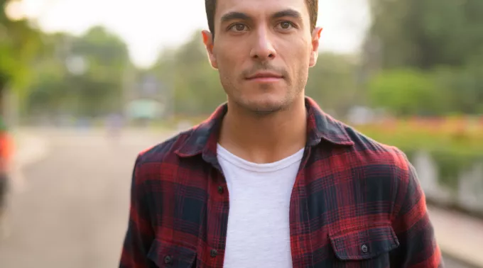 young hispanic man outside