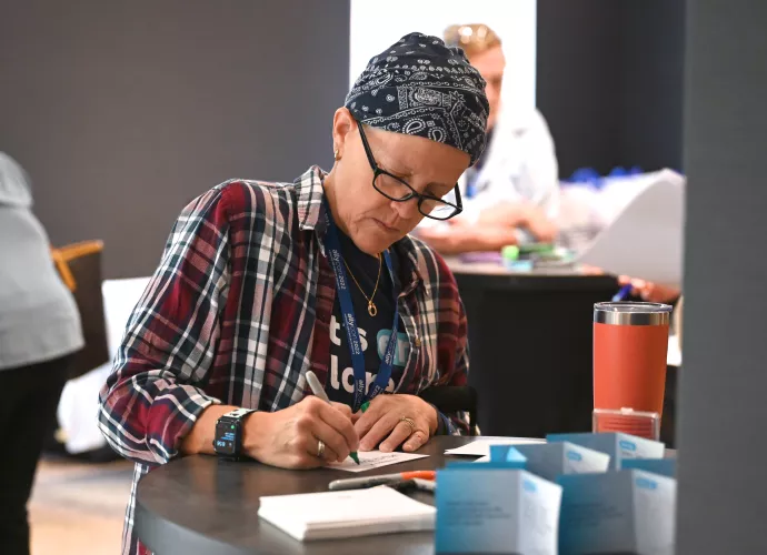 woman in scarf writing