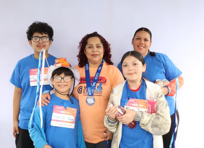 Family at Walk to End Colon Cancer with medals