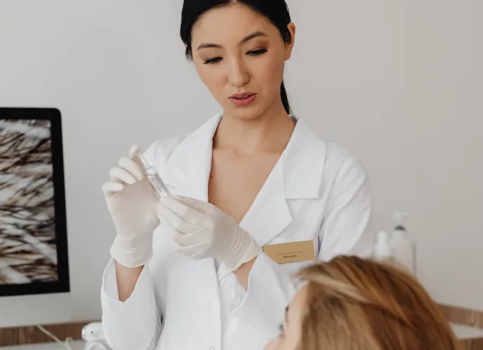 female doctor explaining treatment to female patient