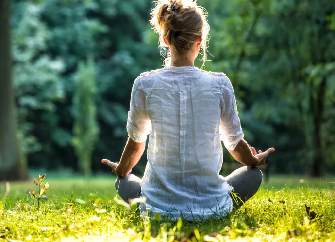 woman doing yoga pose in nature