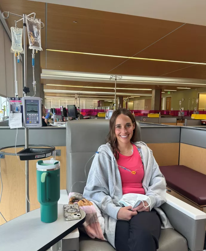 Smiling woman sitting in chair during treatment