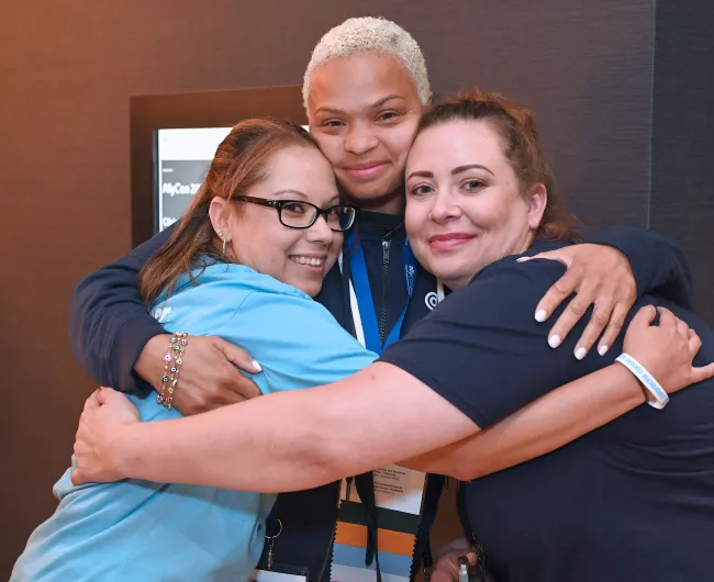 allycon 2022 three woman hugging