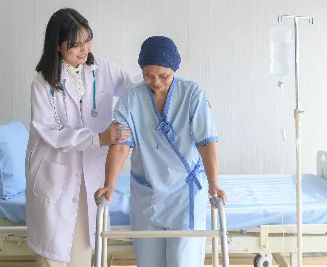 Asian female doctor with elderly Asian female patient