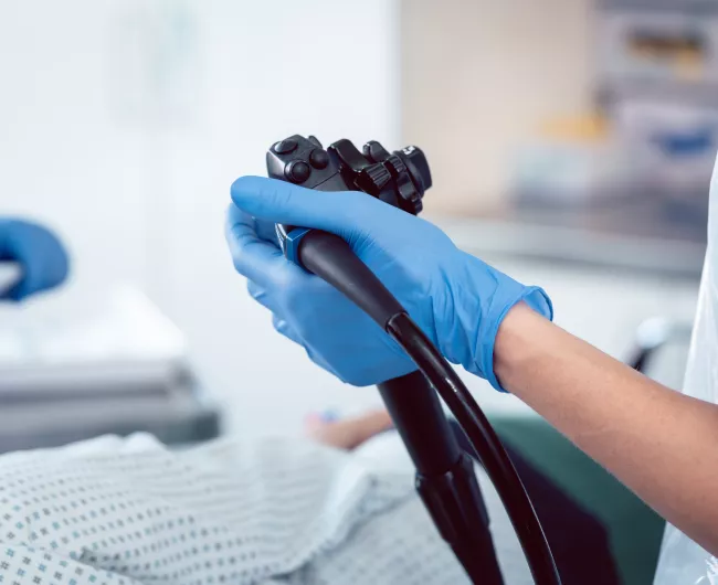doctor holding scope with patient