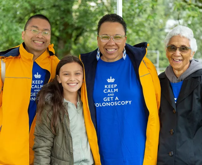 three adults and child in keep calm shirts