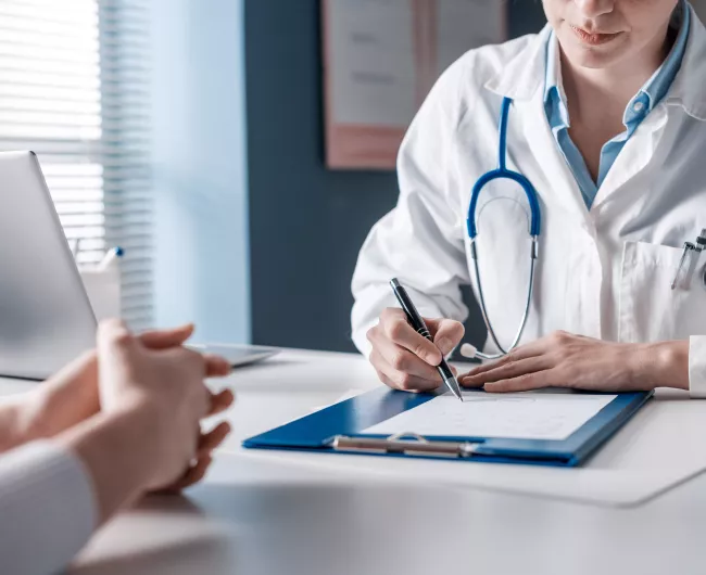 female doctor with blue clipboard