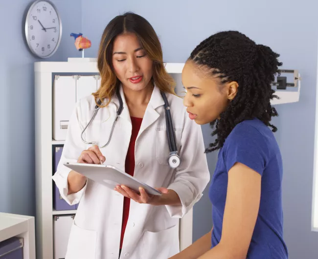 female doctor with female patient