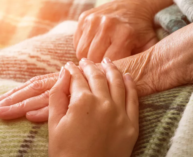 holding hands on bed