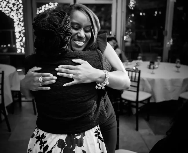Attendees hugging at the 2026 Blue Hope Bash Chicago.