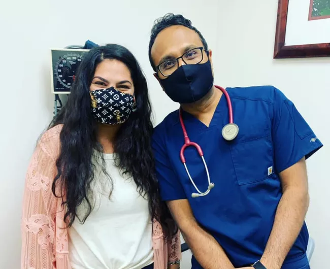 Latina woman with male doctor