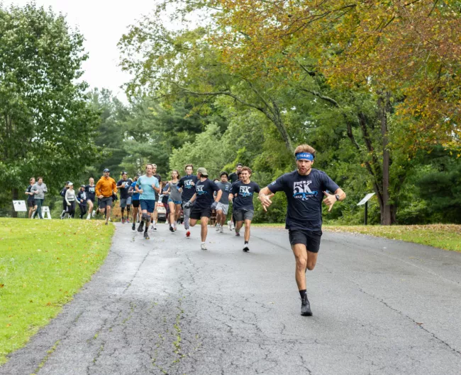 man leads runners at the leslie grace 5k