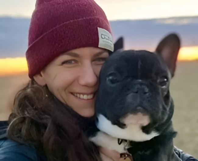 An image of Lori Charney with her dog.