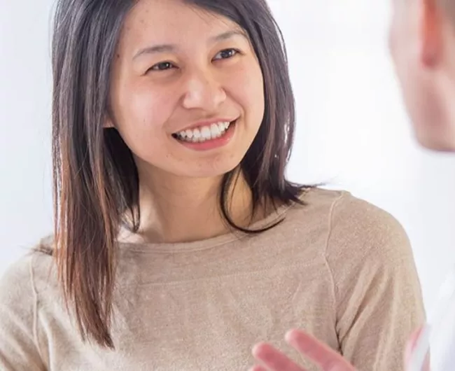 young woman speaking to doctor