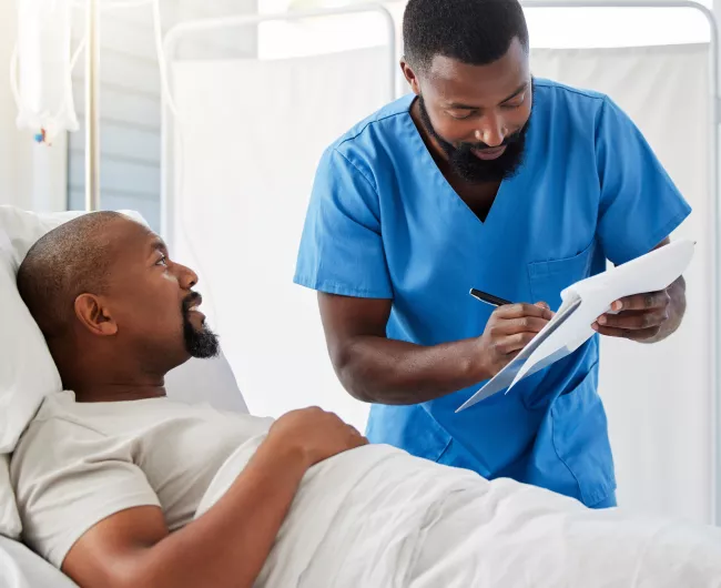 patient in bed with doctor 