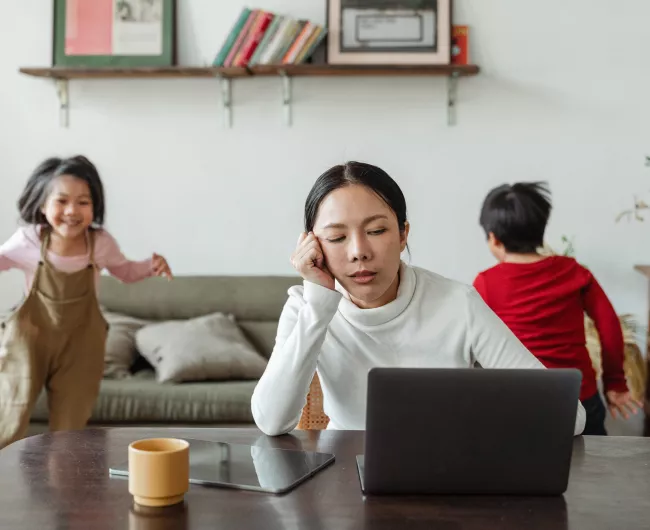 mother at table with young children