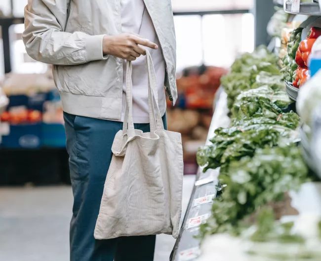 man with bag in grocery store