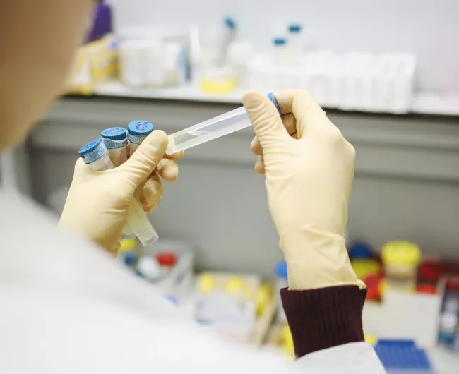 scientist in lab with test tube