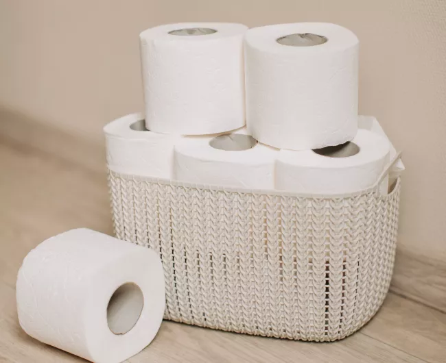 rolls of toilet paper in basket