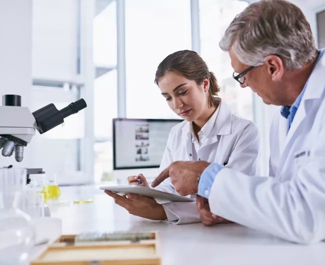 two people doing lab research