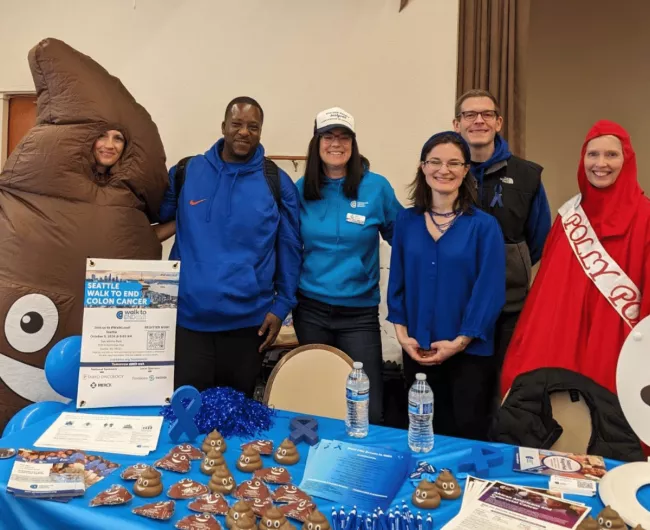 a group of volunteers share colorectal cancer awareness resources