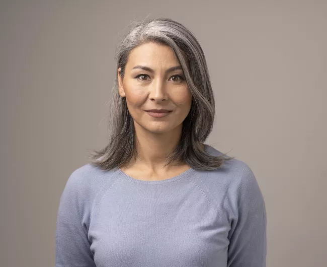 Woman with gray hair and gray background