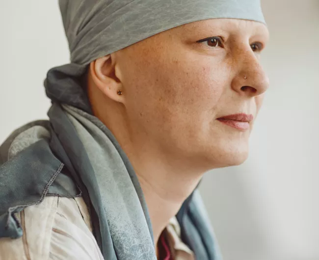 woman in light blue scarf