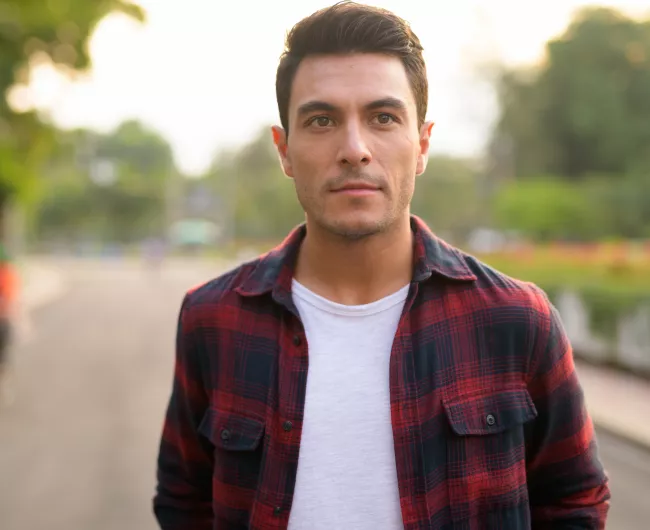 young hispanic man outside