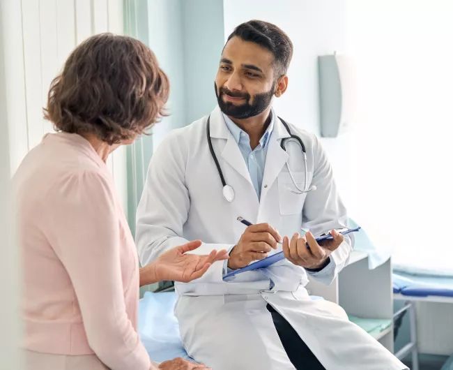 young man talking to doctor