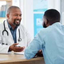research on cancer colorectal male patient with doctor in office