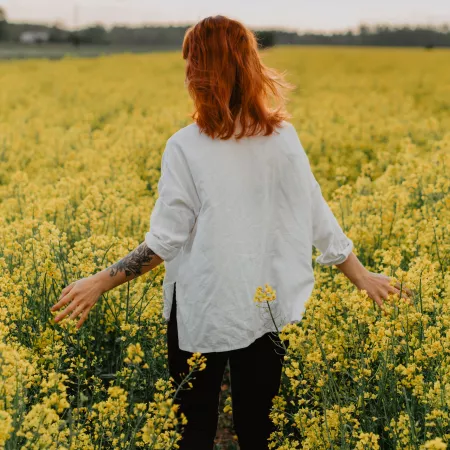 woman in field of flowers